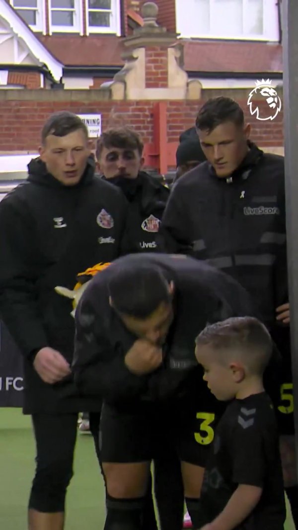 So warm! Xhaka puts on his jacket for ball boy before game